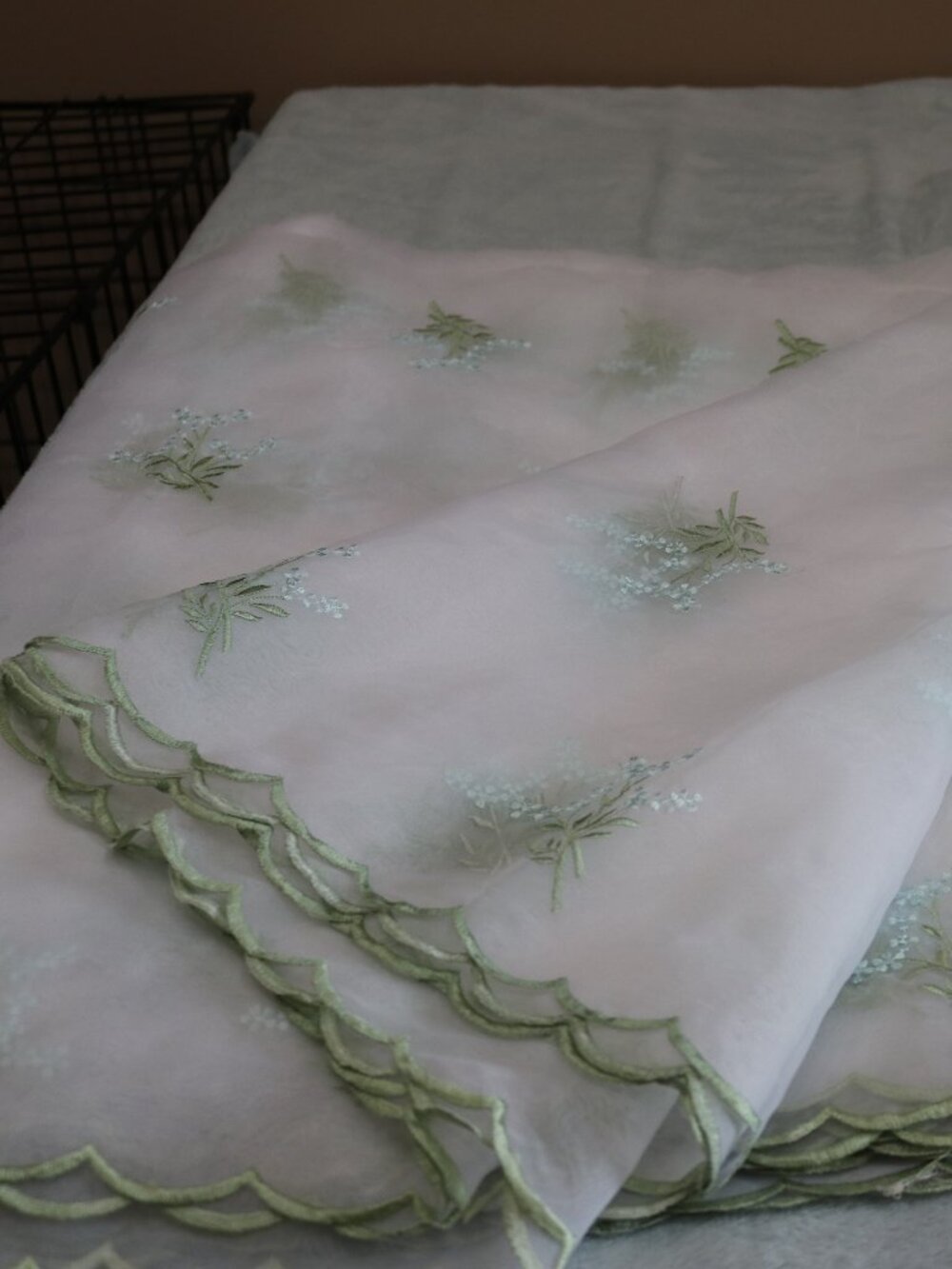 Sheer embroidered 112 x 114" tablecloth.